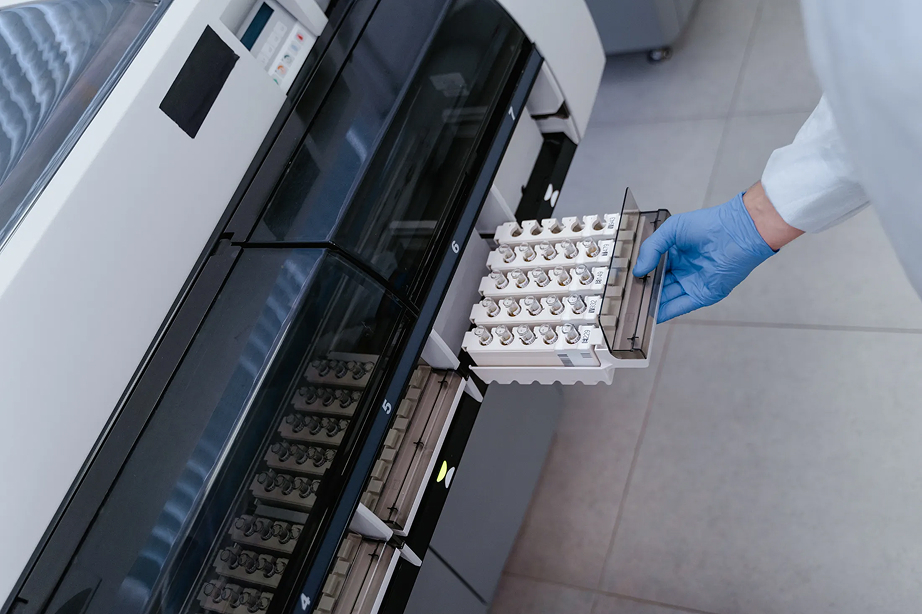 Laboratory technician loading samples into an analytical instrument
